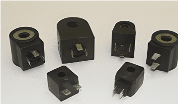 A group of black electrical connectors on a white surface.