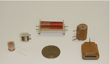 A variety of electronic components are shown on a white surface.